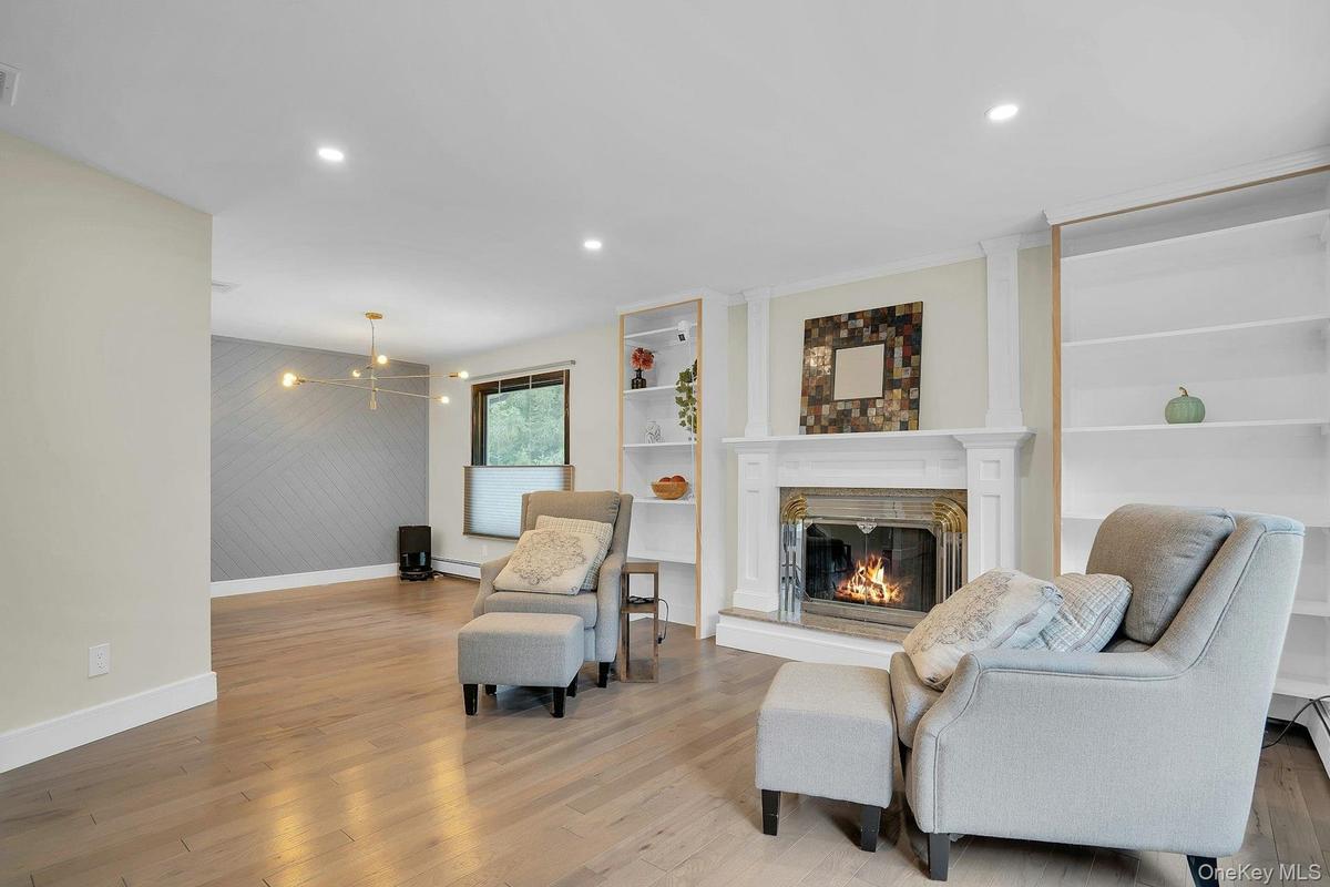 Beautiful fireplace with built-in shelving.