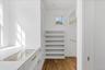 Second floor master suite walk in closet with built ins, jewlry case and safe.