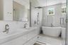 Bathroom with wet room for shower and tub on the second floor.