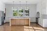 Chefs Kitchen with 48" gas range, double dishwashers and large island.