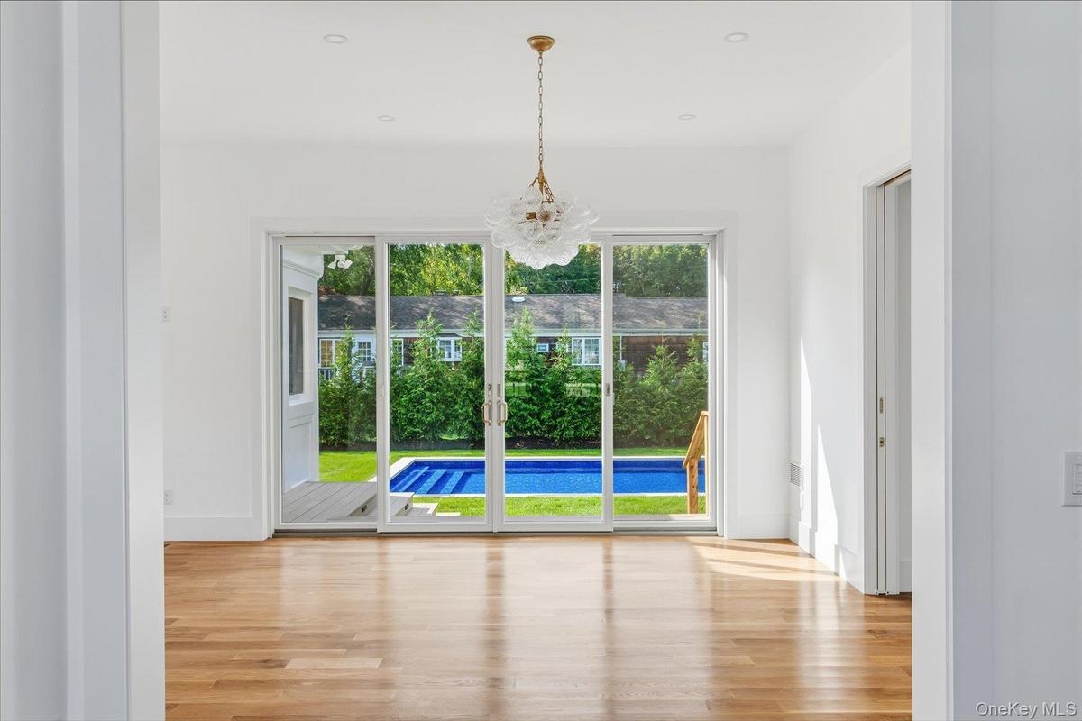 Dining Room with sliding doors to the pool and yard