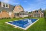 View to the pool house with glass door.