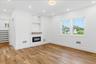 First floor primary bedroom suite or guest suite with walk in closet, custom millwork, fireplace and private office.