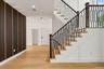 Hardwood flooring with a modern wood slat accent wall