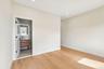 Light wood-finish flooring with recessed lighting