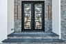 Double-door entry featuring geometric glass inserts and black framing