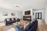 Recessed lighting, wood-finish flooring, and a decorative ceiling fixture
