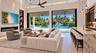 Living room and kitchen, with canal view. Virtually staged.