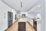 JENN AIR Refrigerator; JENN AIR Dishwasher; Thermador Induction Cooktop; Thermador Wall Oven Microwave Combo; New Cabinetry; Quartzite Countertops wit