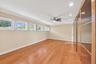 Wood-finish flooring, recessed lighting, and a ceiling fan
