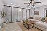 Family room with glass wall-opens to 5th bedroom/office/ exercise room on the 1st flr