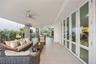 Room for everyone to gather on this covered terrace, with ceiling fans, dining for six, and the calming sound of the fountain