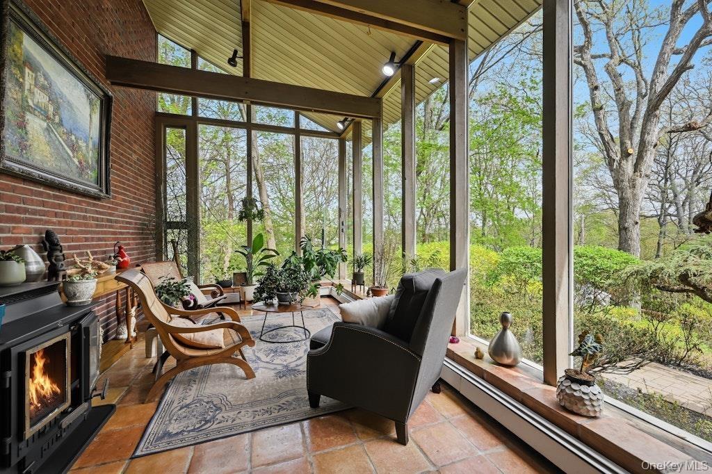 Two story entrance room with fireplace