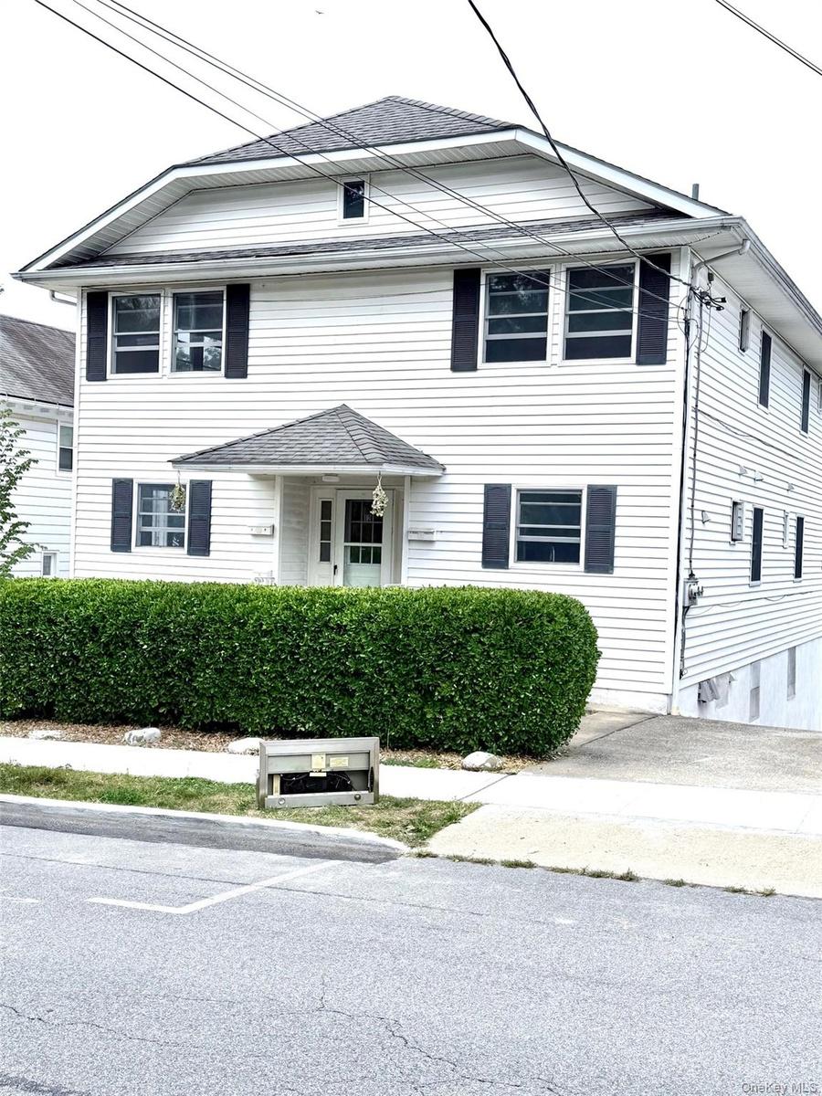 View of front of property with roof with shingles