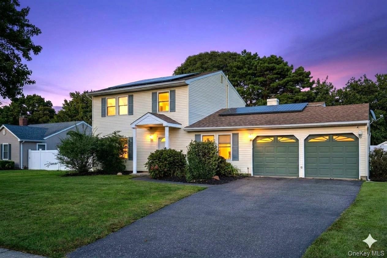 Two-story residence with siding exterior, attached two-car garage, established landscaping, and a paved driveway. AI edited.