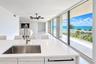 Kitchen with leading to balcony with view