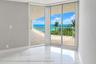 Primary bedroom opens to balcony and view