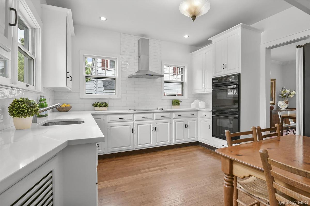 Refreshed kitchen with new quartz counters, double oven, new microwave (2025), new refrigerator (2026) and new cooktop (2025)