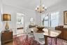 Dining room has hardwood flooring.