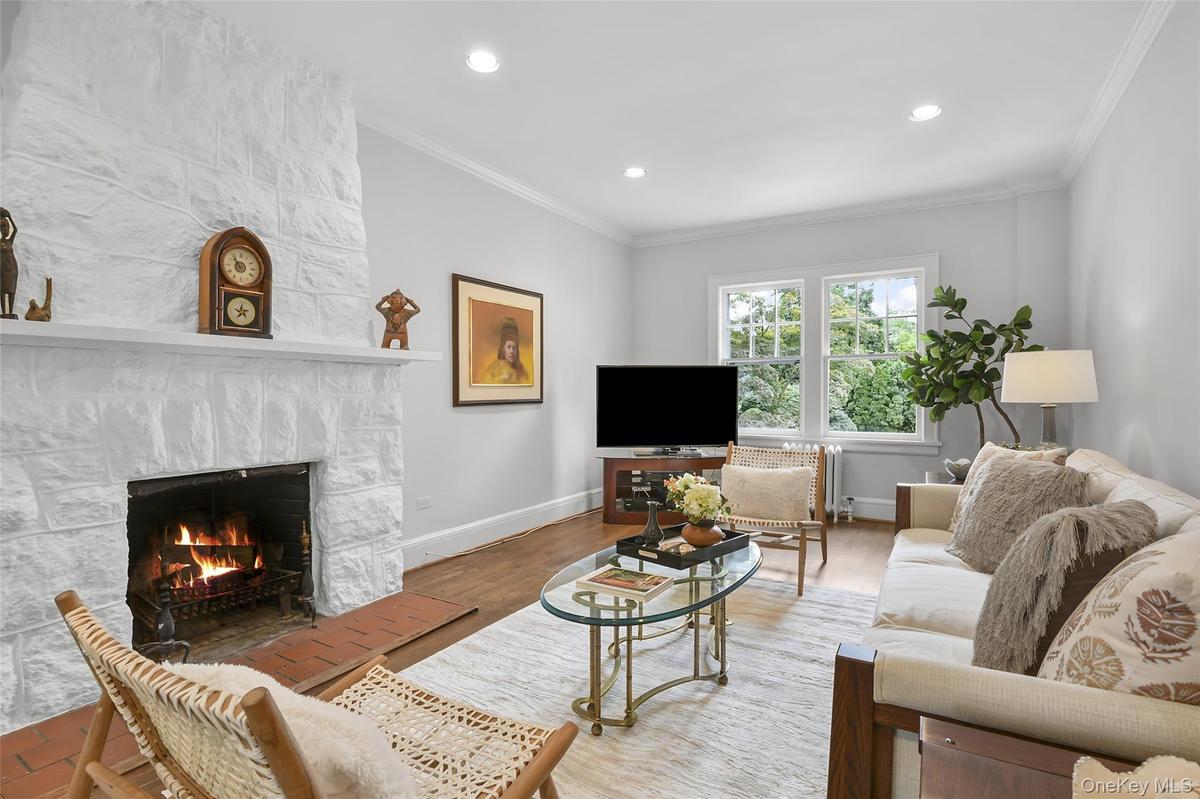 Living room fireplace is wood burning.