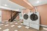 A beautifully finished lower level with dedicated laundry and ample utility space.