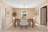 **Virtually Staged** Recessed window with exterior views, overhead chandelier, and light-toned tile flooring