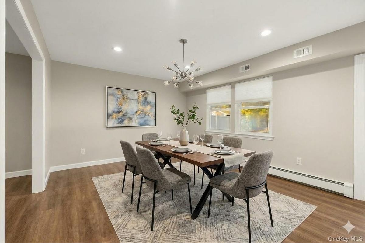 AI edited, virtually staged dining room. Currently set up as kids playroom.