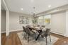 AI edited, virtually staged dining room. Currently set up as kids playroom.