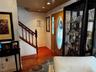 Hardwood flooring, recessed lighting, and a wood staircase with balusters