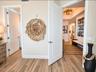 TO THE LEFT IS THE BATH TO THE RIGHT THE HALLWAY TO THE KITCHEN