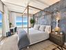 PRIMARY BEDROOM DIRECT OCEAN VIEW ACCESS GLASS SLIDER TO BALCONYKING SIZE BEDENSUITE BATHDESKTV