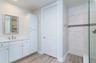 Master bath has 2 vanities,  water closet.