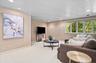 The primary suite also offers an attached cozy sitting area/den.