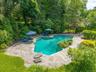 The property features an in-ground heated pool, perfect for entertaining!