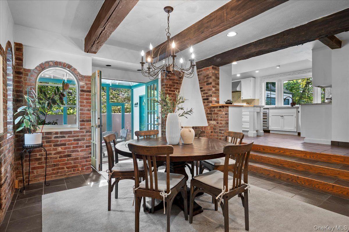 The breakfast room opens onto a screened in porch, perfect for al fresco dining and relaxing.