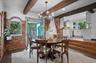 The breakfast room opens onto a screened in porch, perfect for al fresco dining and relaxing.
