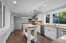 The kitchen opens onto the breakfast room and connects to the formal dining room; an ideal layout for entertaining.