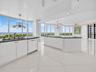 Open kitchen with breakfast nook and dining room view.