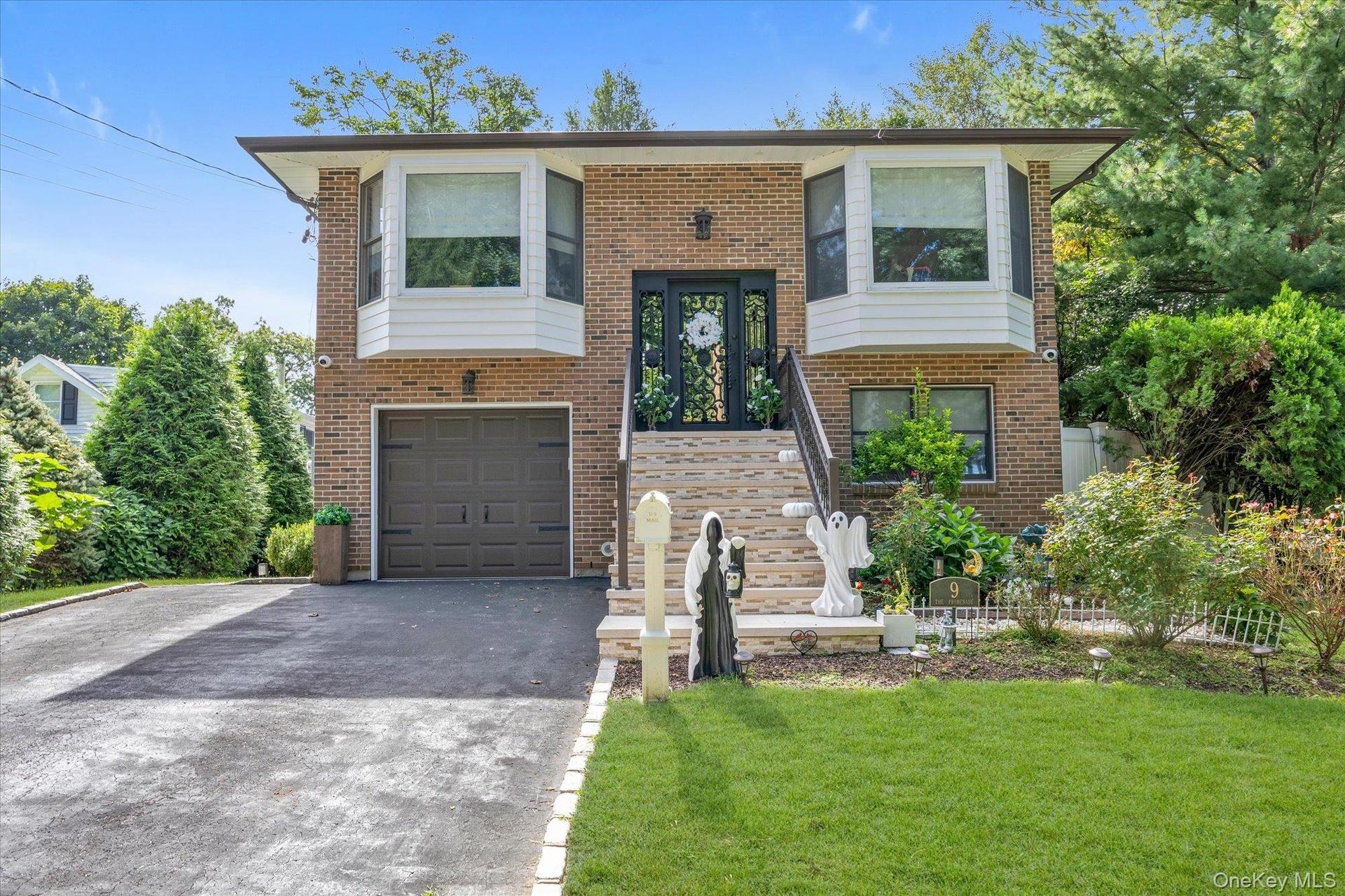 Brick & Cedar exterior.  2023: new roof, soffit's w/lighting, gutters replaced stairway, railings  front door & garage door.