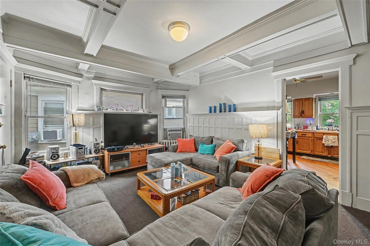 Unit 1 Living Room with tray ceilings custom millwork