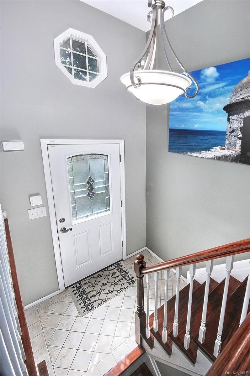 foyer with staircase to main level