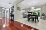 Country kitchen w/sliders to decking!Hardwood-finish flooring, light-toned wall paint, sliding glass door, overhead lighting fixture, and tile floorin