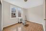 Spare room with radiator heating unit and light wood-style flooring
