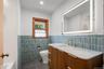 Full bath with tub, glazed tile and fogless mirror
