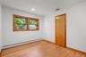 Sunny bedroom with closet