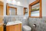 Half bath with elegant glazed tile