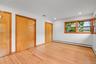 Primary bedroom with two large closets and mid-century window detail