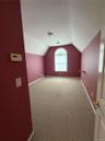 3rd bdrm upstairs, large arched window,