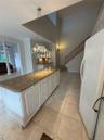 Extended granite counter with cabinetry