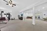 Recessed lighting, ceiling fan, white paneled doors, carpeted flooring, and French doors